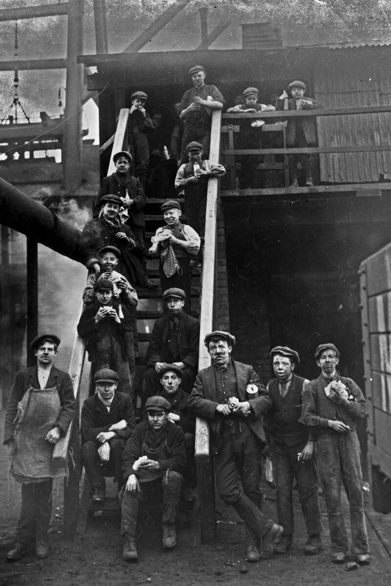 A group of “pit boys” wait to go to work in the Sirland & Alfreton pits in Derbyshire, England, 1905