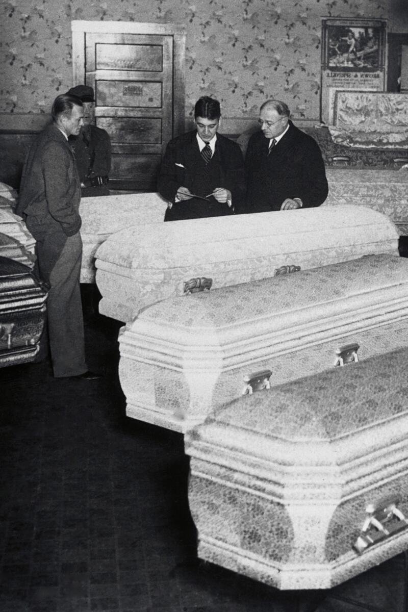 Funeral parlor scene for coal mining victims.