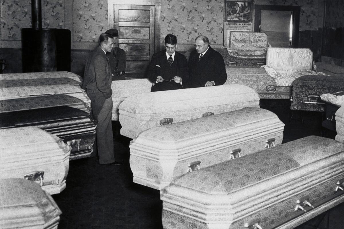 Funeral parlor scene for coal mining victims.
