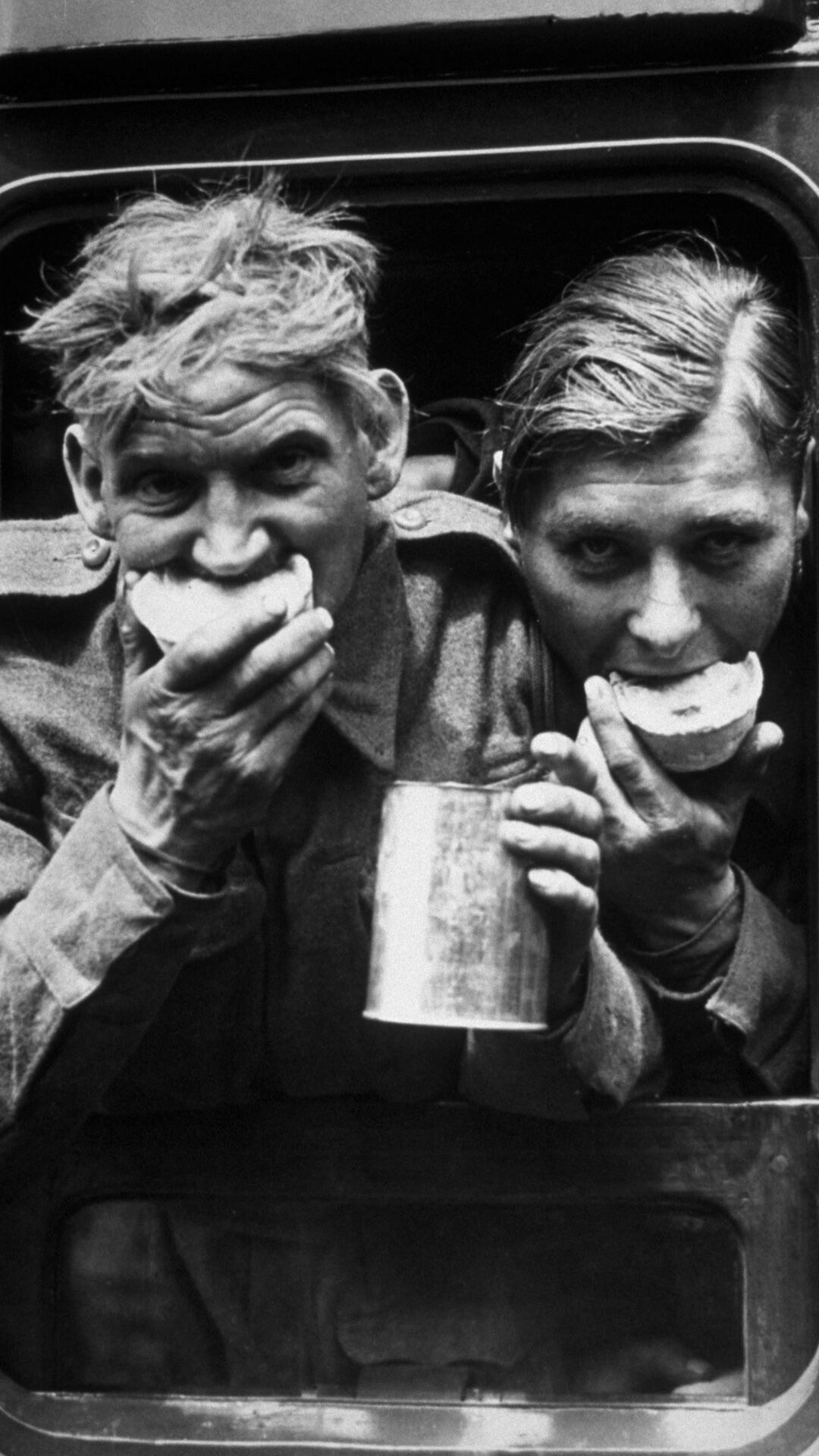 Two soldiers enjoying refreshments 