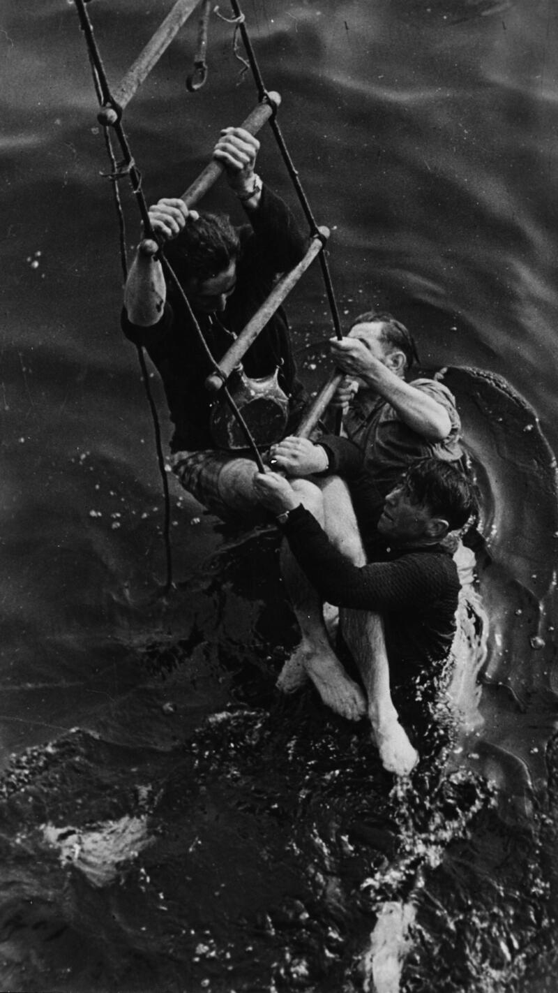 3 men being rescued.