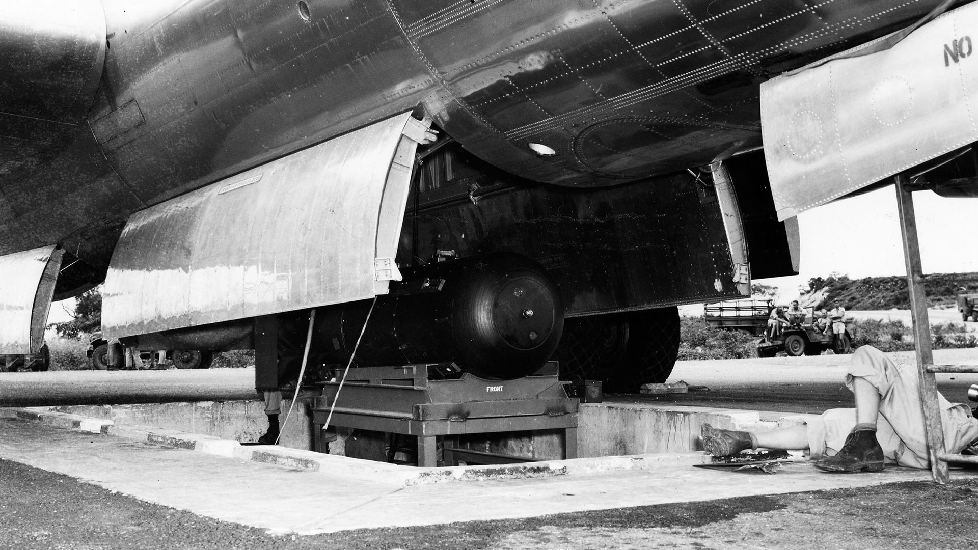 The atomic bomb, codenamed 'Little Boy', as it is hoisted into the bomb bay of the Enola Gay.