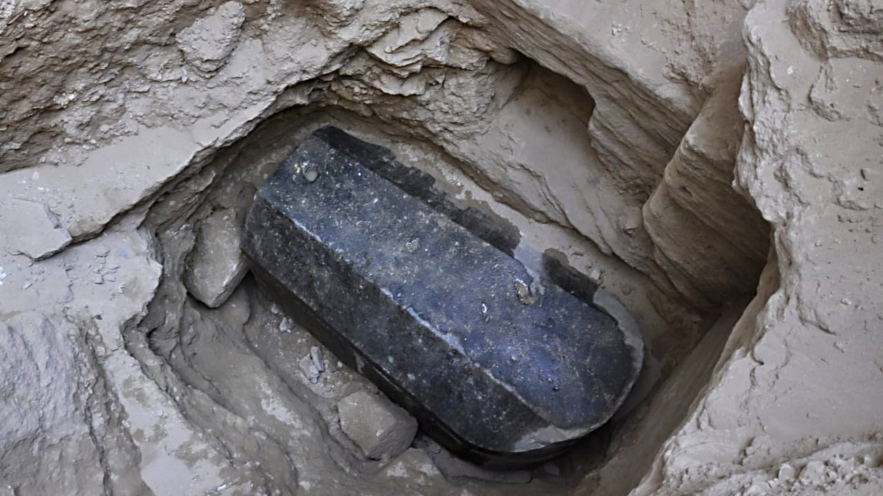 Mysterious black sarcophagus opened to reveal sewage water and bones Mysterious black sarcophagus opened to reveal sewage water and bones