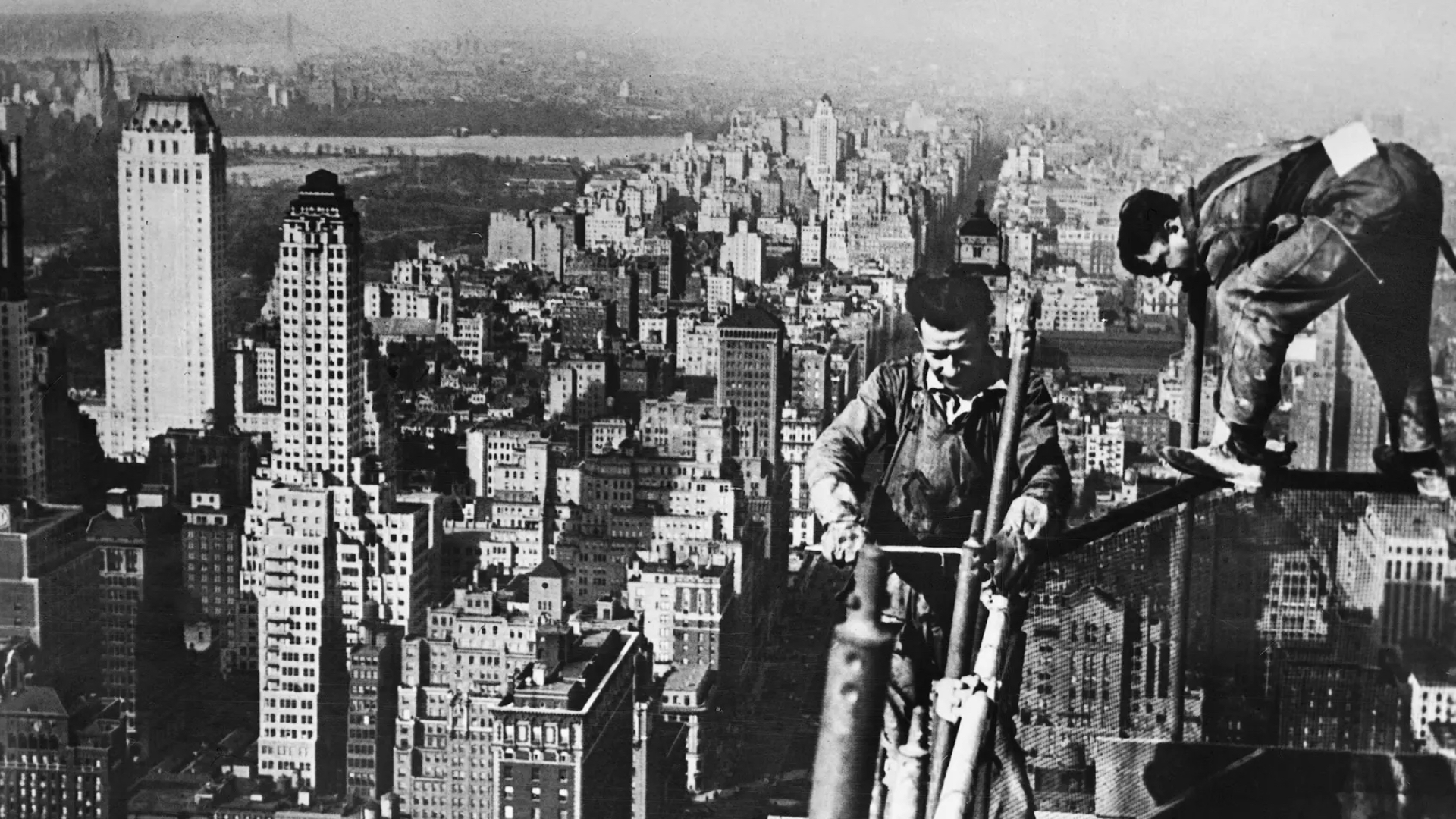 Workers working high atop the empire state building during its construction (Gamma-Keystone via Getty Images)