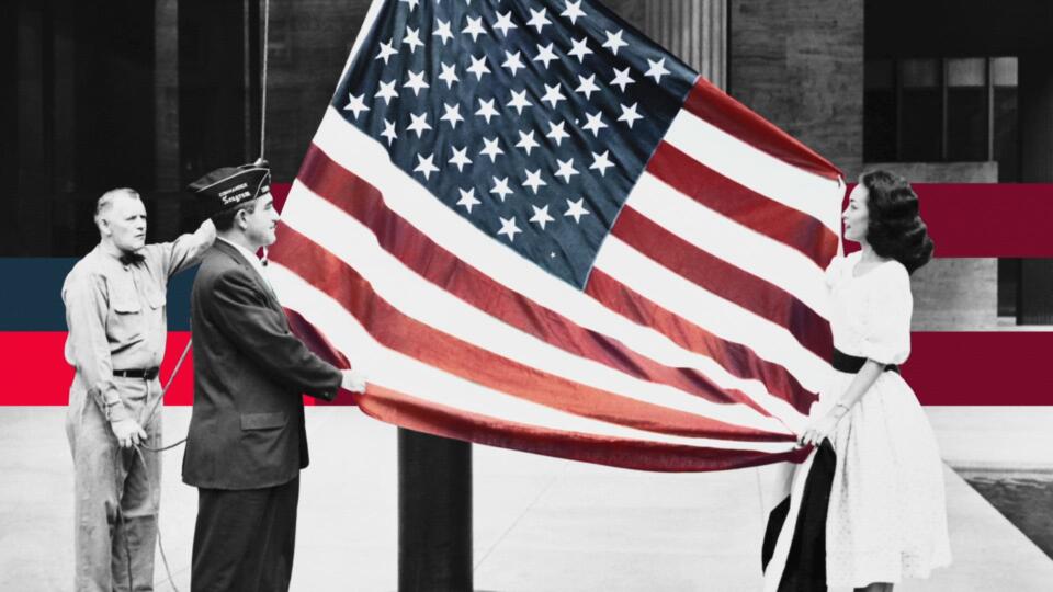 a photo of an American flag being held by two hawaiians