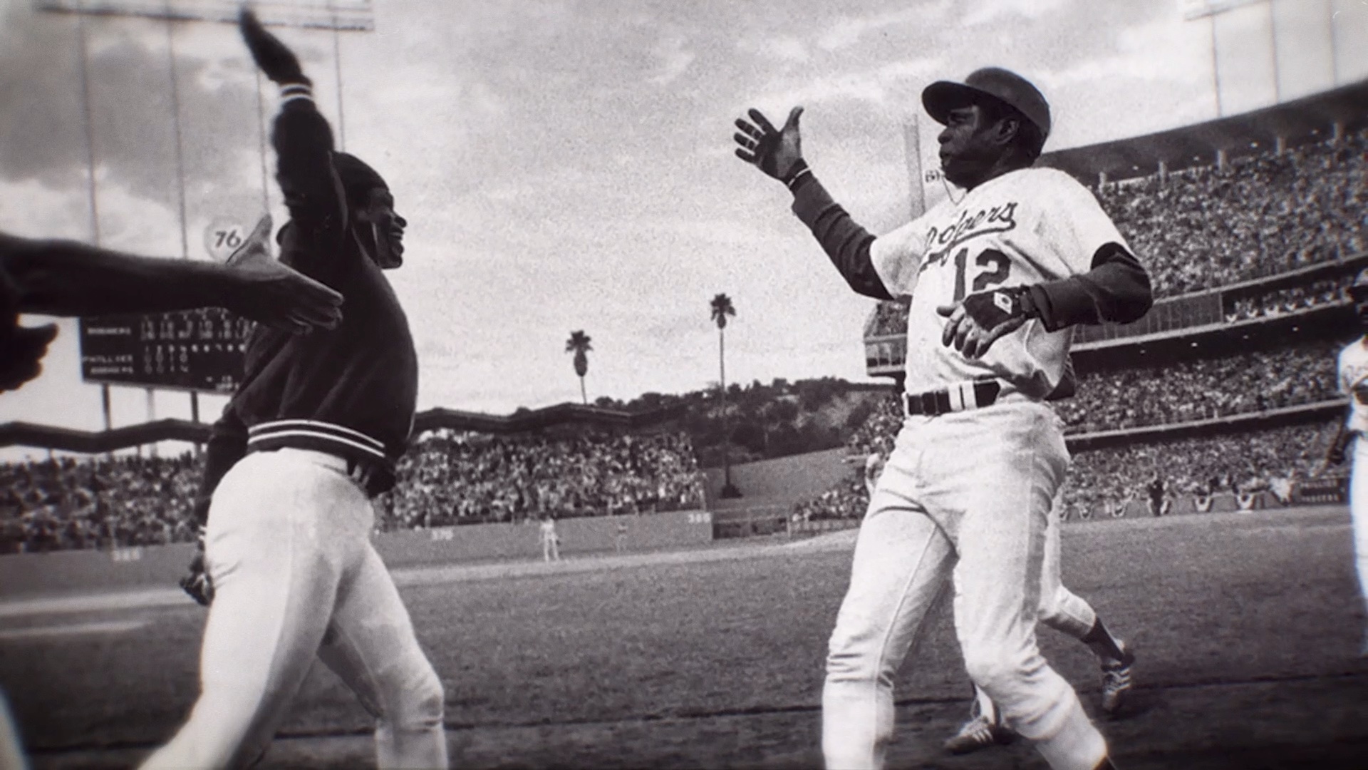 a phot of Glen Burke and Dusty Baker high fiving in 1972
