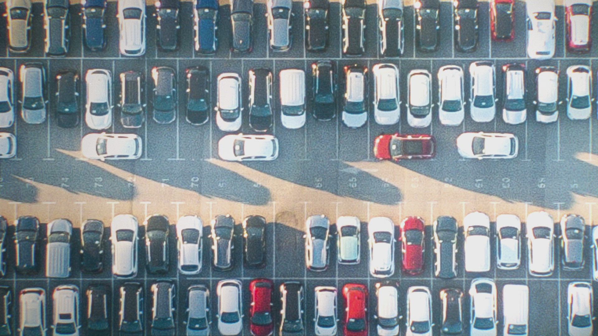 a photo cars in a parking lot from an overhead perspective