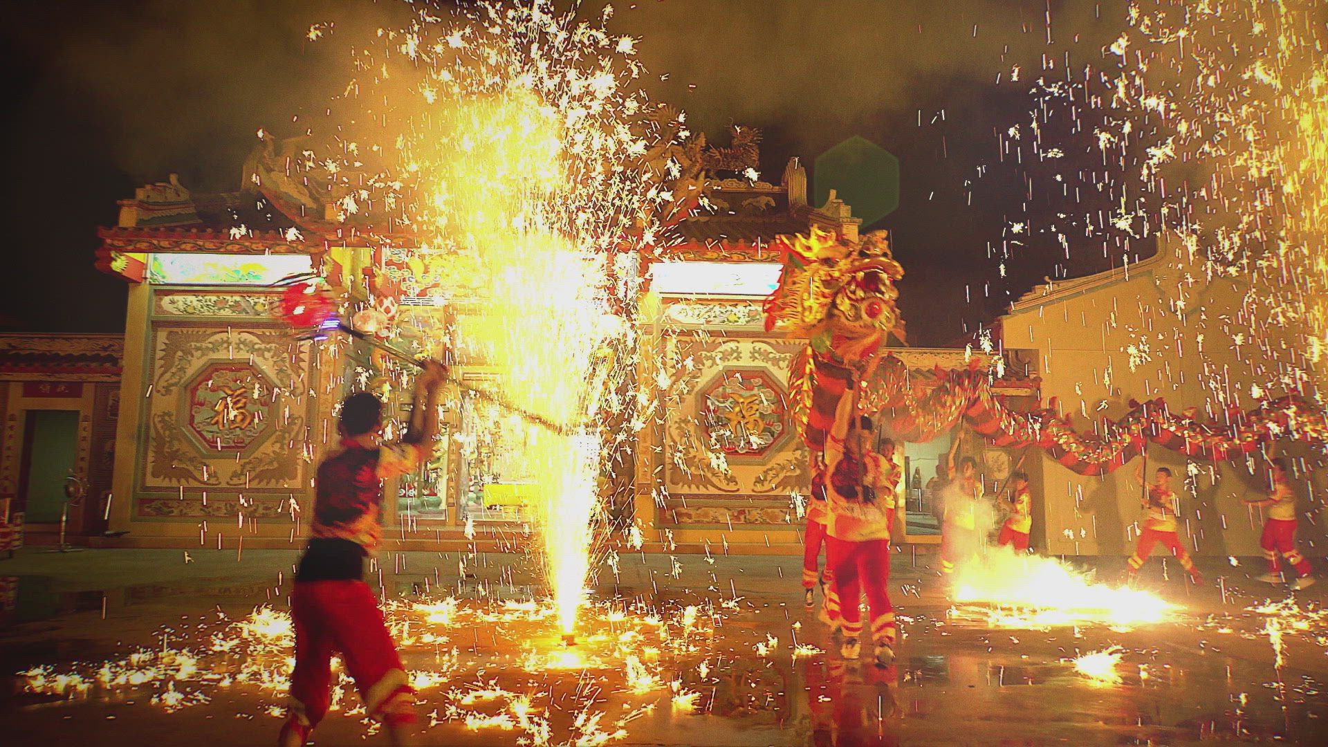 a photo of a traditional chinese new year celebration with a dragon and fireworks and performers