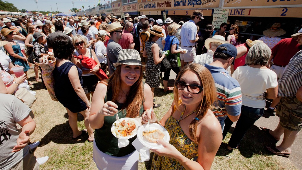 Enjoying the food at New Orleans Jazz Fest. (Photo by Douglas Mason/Getty Images)
