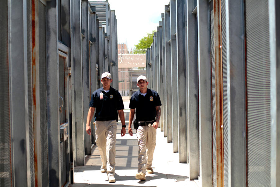 COs Chavez and Salazar walk through the yard