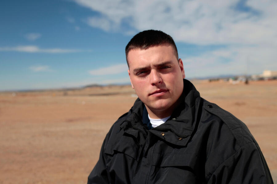 CO Mangin stands in front of PNM