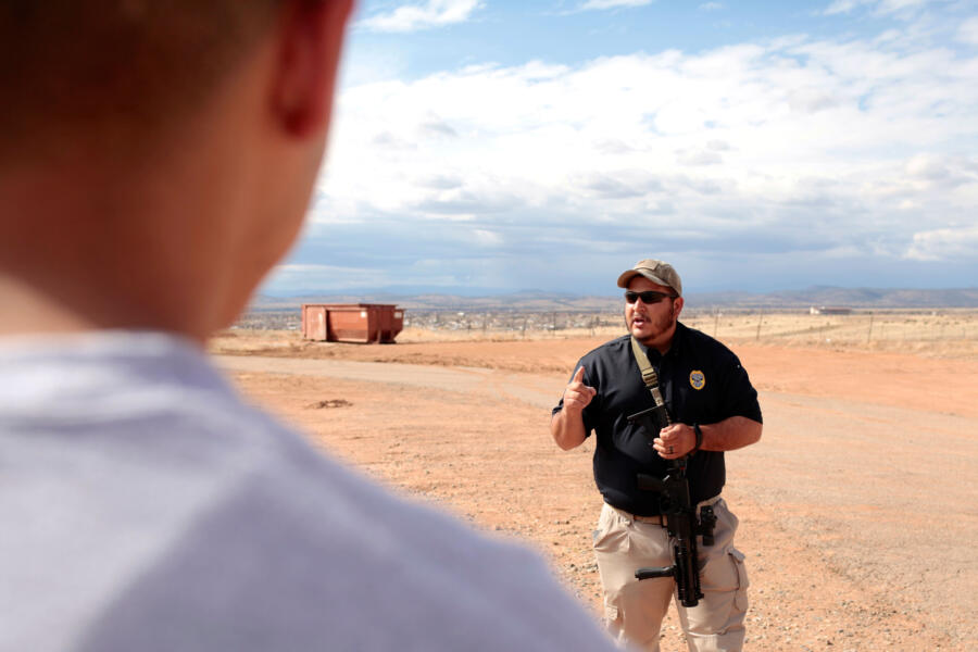 A firearms instructor teaches class