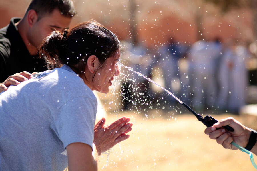 Cadet Ariel rinses her face