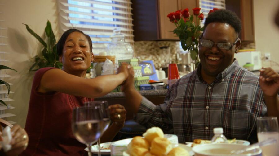 John and his sister high five