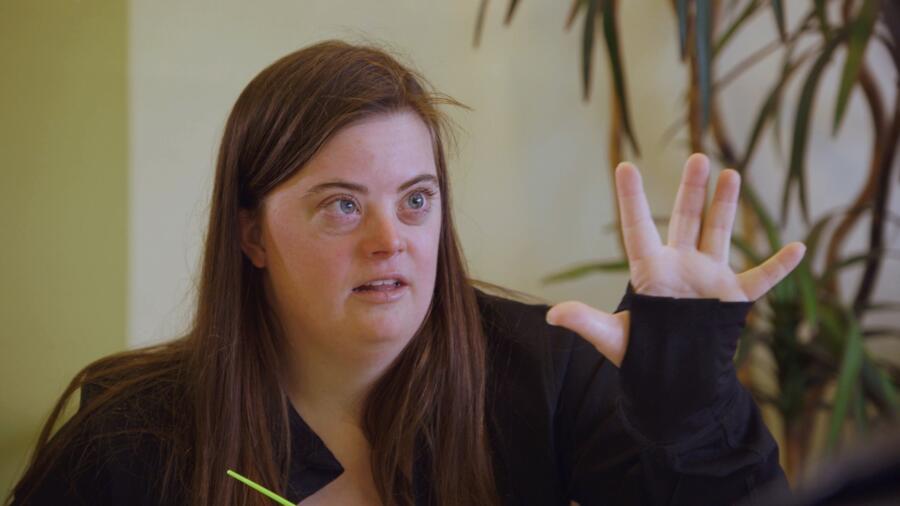 Caley suggests a pose to John