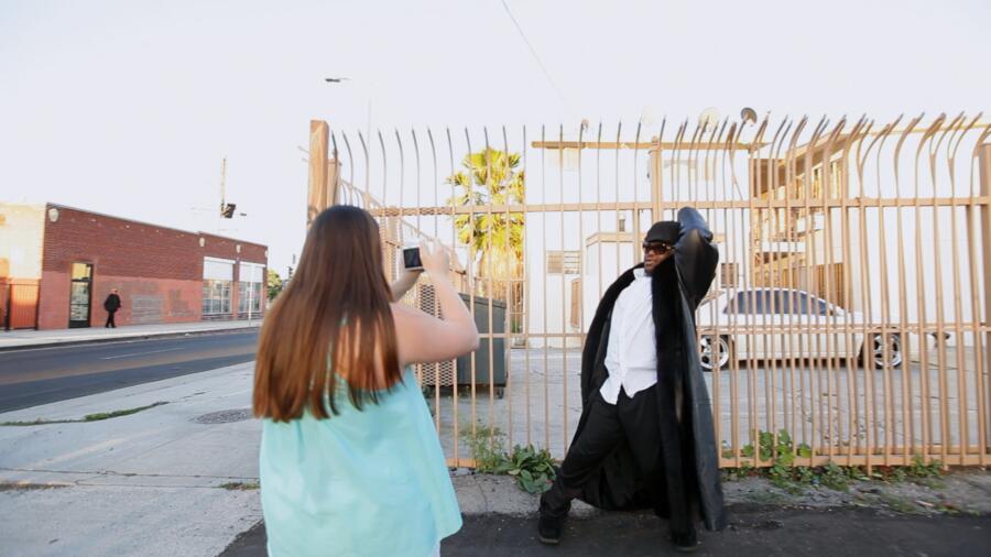 John rocks out poses