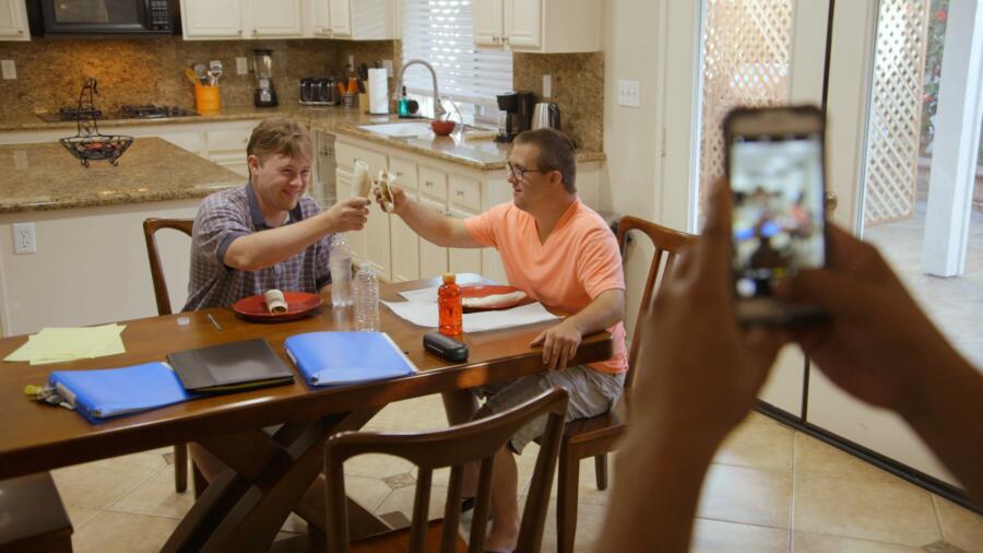Steven and Sean toast burritos