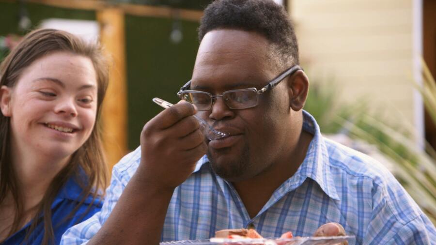 John thoroughly enjoys his cake