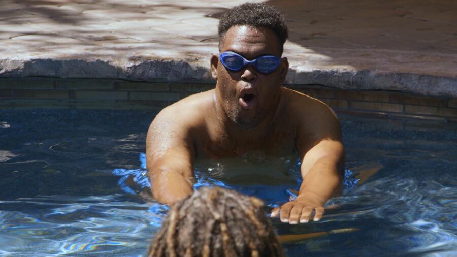 John takes a swimming lesson