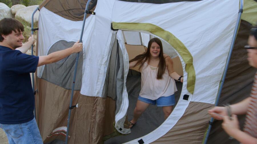 Caley, Jared, and Cole put up a tent
