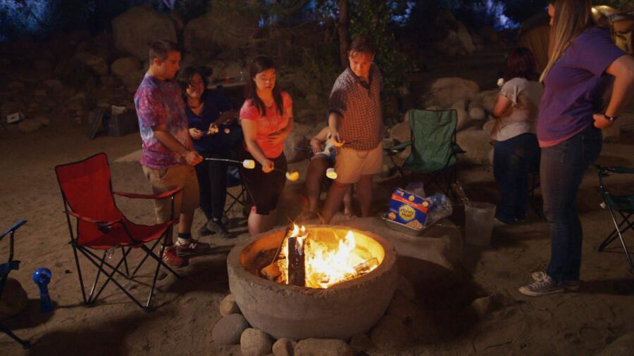 Sean, Elena, Cristina, and Steven roast marshmallows