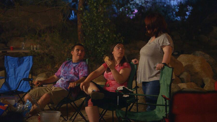 Sean, Cristina, and Rachel enjoy s’mores