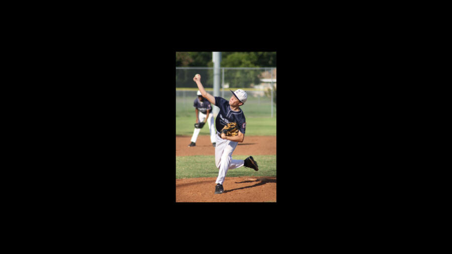 Cole Robertson from Duck Dynasty pitching during a high school baseball game