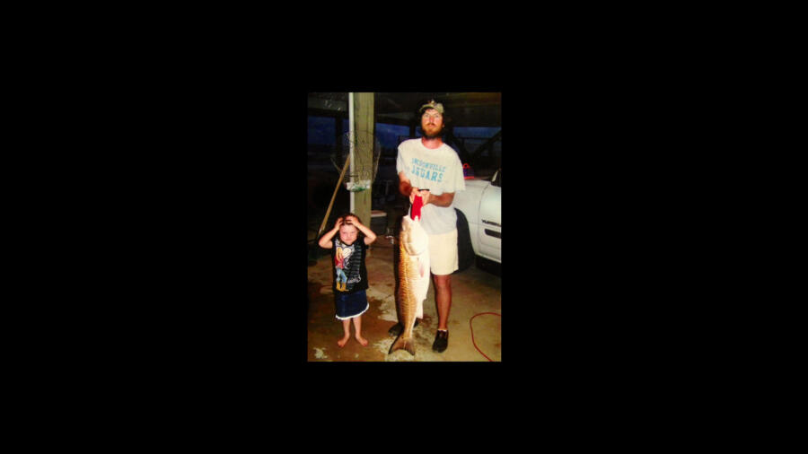 Jase Robertson from Duck Dynasty after catching a fish with daughter Mia
