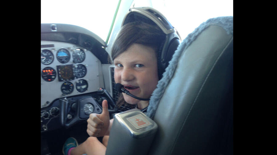 Mia Robertson from Duck Dynasty in a co-pilot seat on a plane