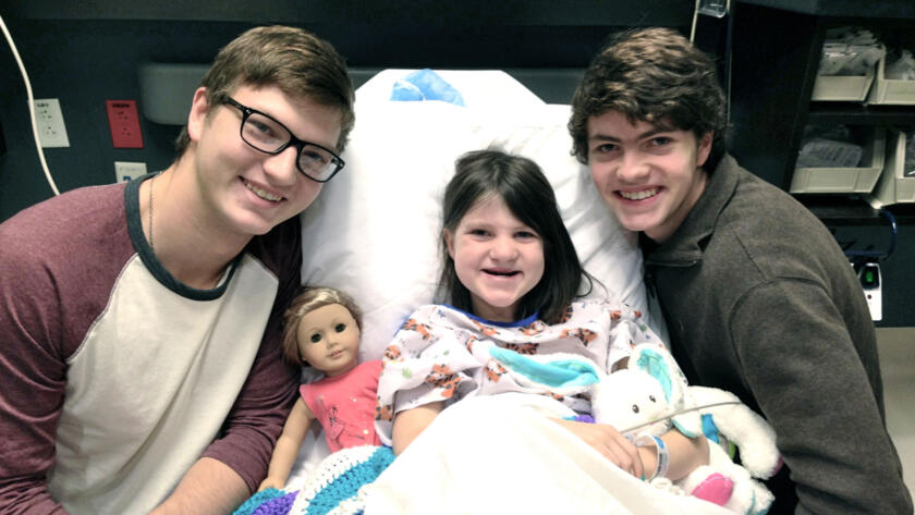 Reed and Cole Robertson from Duck Dynasty with their sister Mia in the hospital