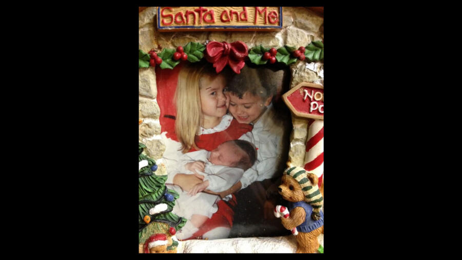 Old photo of Duck Dynasty's Sadie and John Luke Robertson with baby brother Will