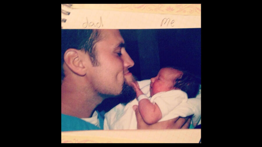 Old photo of Willie Robertson with his baby daughter Bella