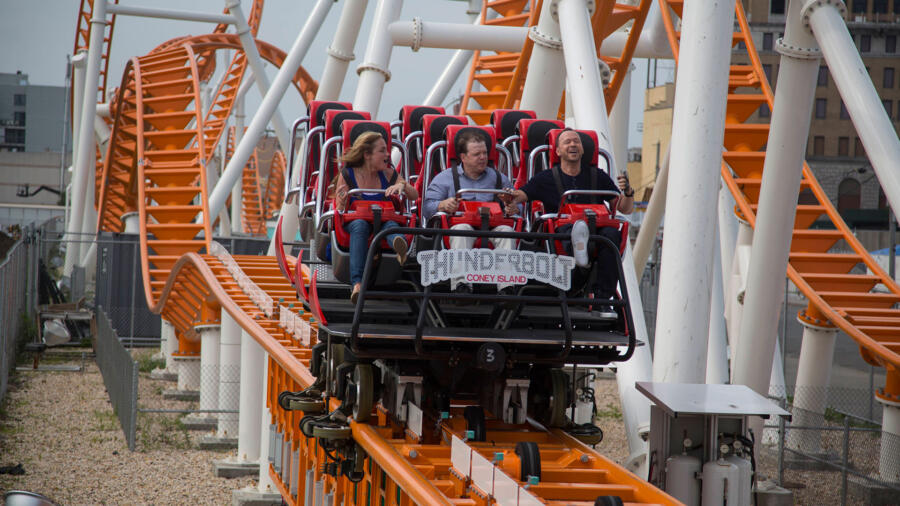 The gang rides a roller coaster.