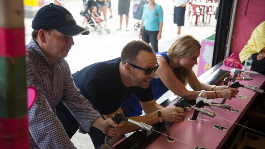Paul, Donnie and Kari play a game.