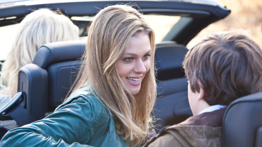 Bradley sits on Norman's lap