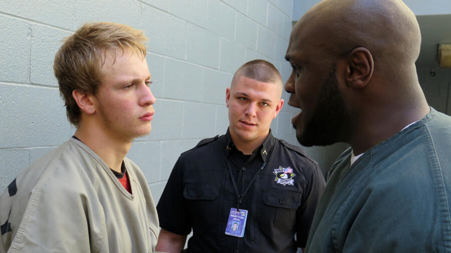 Brynlee listens to an inmate