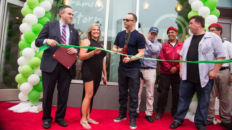Donnie prepares to cut the ribbon.