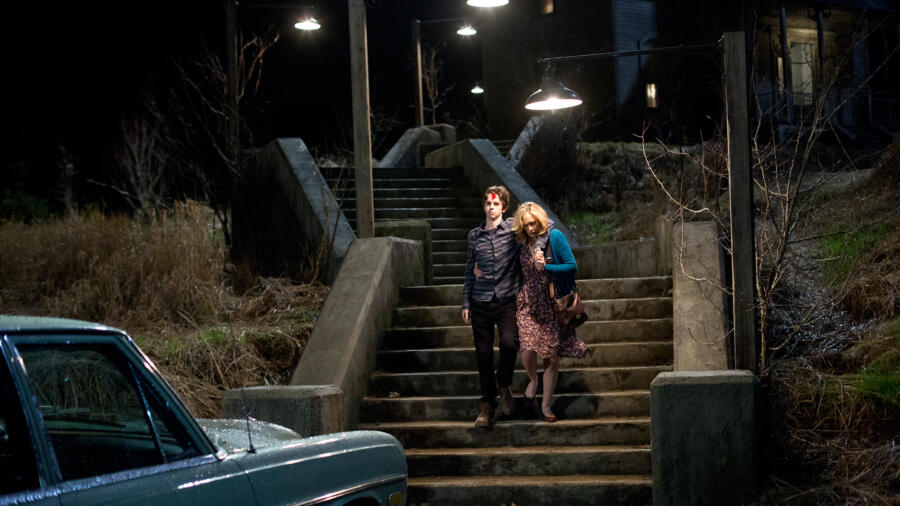 Norma helps Norman to car