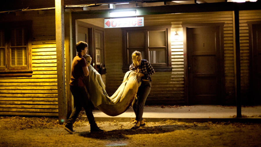 The Bates haul Summers' body into room