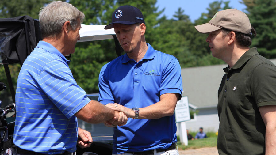 Jim shakes hands with Bobby Orr