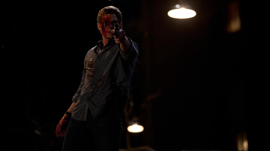 Shelby aims his gun at Norma