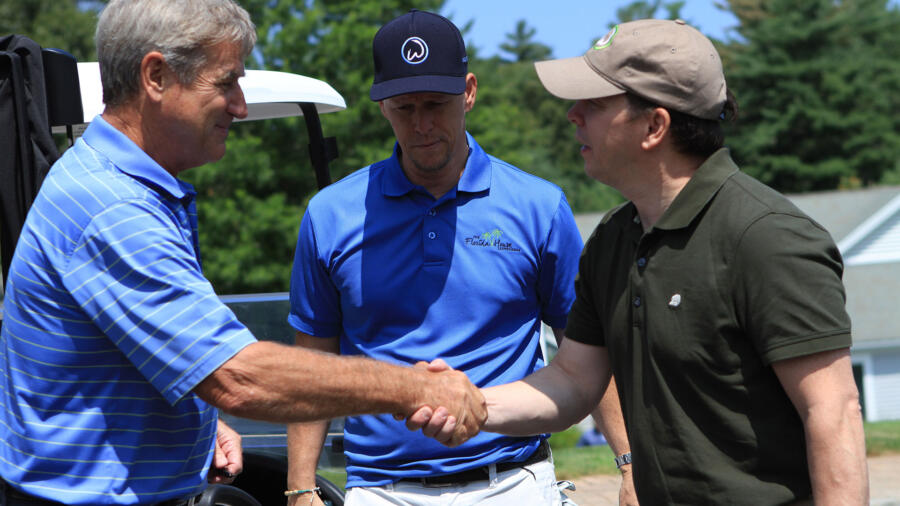 Paul shakes hands with Bobby Orr