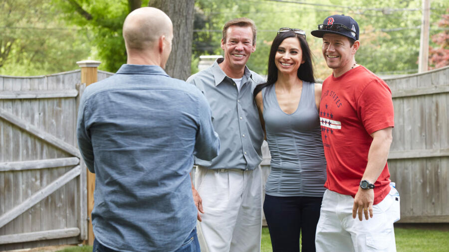 Jim takes a photo of Arthur, Jennifer and Mark