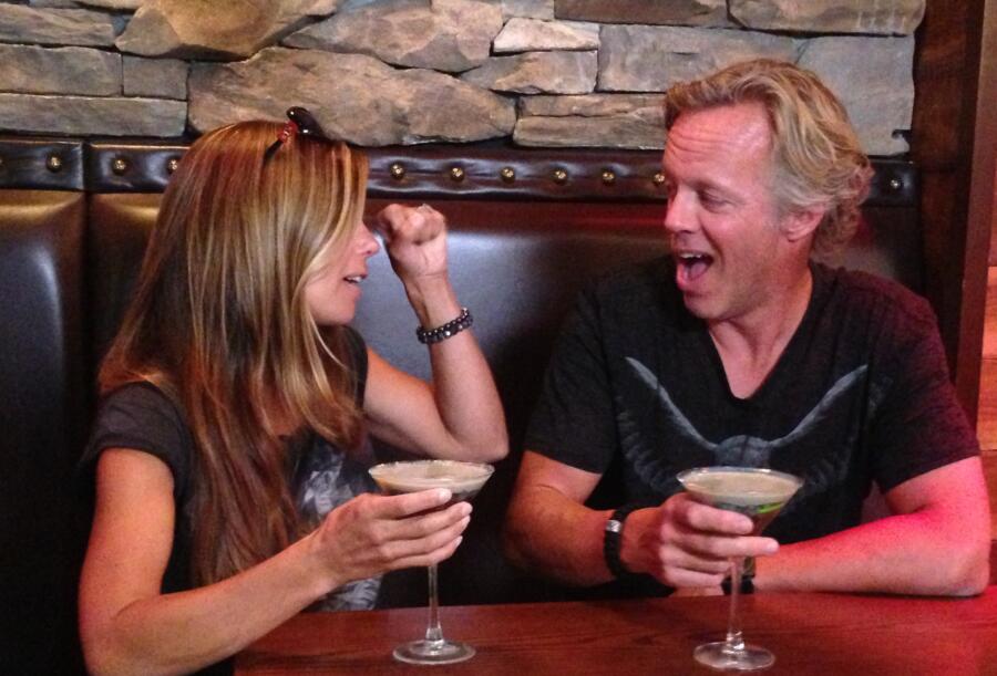 The happy couple enjoys a cocktail after one of their successful flips.