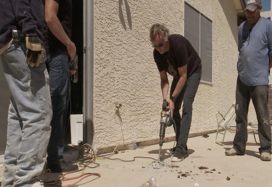 Scott takes matters into his own hands by jackhammering a back porch.