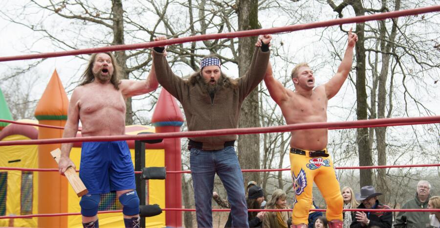 Willie introduces the wrestlers, including "Hacksaw" Jim Duggan (on left).