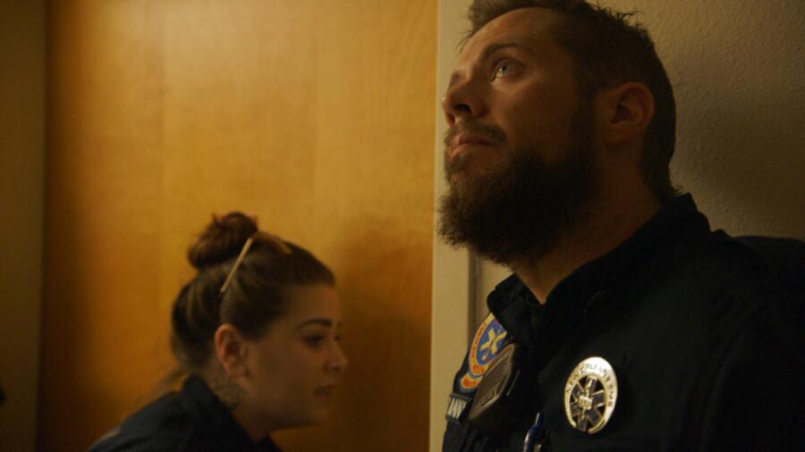 Holly and Nick try to get a man who has a severed finger to open a door so they can treat him