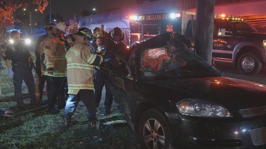 Firefighters use the jaws of life on a mangled car
