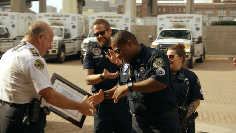 Titus receives his EMS certificate from the Chief
