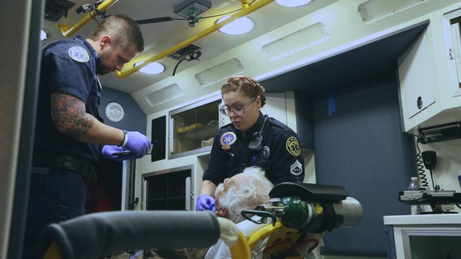Nick and Holly work on a patient
